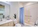 Clean bathroom featuring a tub with shower, vanity with mirror, and toilet at 2945 Trustee Ave, Sarasota, FL 34243