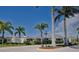 Street view of the neighborhood entrance with signage and manicured landscaping at 2945 Trustee Ave, Sarasota, FL 34243