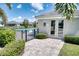 Building next to community pool features double door and well kept landscaping at 2945 Trustee Ave, Sarasota, FL 34243