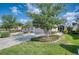 Well-manicured lawn and landscaping enhance the curb appeal of this charming single Gathering home at 2945 Trustee Ave, Sarasota, FL 34243