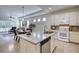 Modern kitchen open to dining and living areas featuring granite counters and stainless appliances at 2945 Trustee Ave, Sarasota, FL 34243