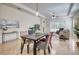 Open-concept living and dining area with tile floors, neutral tones, and plenty of natural light at 2945 Trustee Ave, Sarasota, FL 34243
