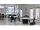 Bright and airy common area for social gatherings with tables and chairs at 3002 Sail Pointe Cir # 1B, Venice, FL 34293