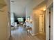 Hallway view leading to the dining area and living room, showcasing the open floor plan at 3002 Sail Pointe Cir # 1B, Venice, FL 34293