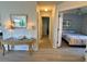 Bright hallway leading to a bedroom with a stylish table and lamps at 3002 Sail Pointe Cir # 1B, Venice, FL 34293