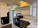 Well-lit kitchen with stainless steel appliances, ample cabinet space, and inspiring wall decor at 3002 Sail Pointe Cir # 1B, Venice, FL 34293