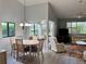Open-concept living and dining area with lots of natural light at 3002 Sail Pointe Cir # 1B, Venice, FL 34293