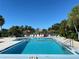 Enjoy a refreshing swim in the pristine community pool, enhanced by tropical foliage and convenient sun shelters at 3002 Sail Pointe Cir # 1B, Venice, FL 34293