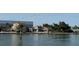 Beautiful waterfront homes with tile roofs, docks, and lush landscaping for relaxing outdoor living at 3002 Sail Pointe Cir # 1B, Venice, FL 34293