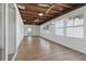 Bright and airy sunroom featuring lots of windows, ceiling fans, and wood-look flooring at 3105 Gulfgate Dr, Sarasota, FL 34231