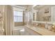 Bathroom with a shower-tub combo, decorative mirror and neutral color scheme at 4037 Wooley Ave, North Port, FL 34287
