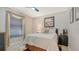 Bedroom with a bed, window and art on the wall at 4037 Wooley Ave, North Port, FL 34287