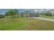 Spacious home featuring a well-maintained lawn and a two-car garage, ideal for Gathering living at 4037 Wooley Ave, North Port, FL 34287