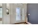 Inviting foyer featuring a decorative glass door, tile flooring, and tasteful interior design at 4037 Wooley Ave, North Port, FL 34287
