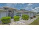 Attractive single-Gathering home with neat landscaping, decorative stone, and a welcoming front entrance at 4037 Wooley Ave, North Port, FL 34287