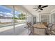 Screened in lanai with view of pool and garden area at 4037 Wooley Ave, North Port, FL 34287