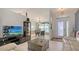 Bright living area with open layout, dining access, and decorative elements create a cozy atmosphere at 4037 Wooley Ave, North Port, FL 34287