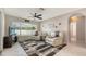 Comfortable living room with tile floors, ceiling fan, natural light and modern decor at 4037 Wooley Ave, North Port, FL 34287
