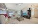 Inviting living room with comfortable seating, neutral decor, and seamless access to outdoor view at 4037 Wooley Ave, North Port, FL 34287