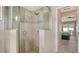 Tiled standing shower with glass surround and tiled floor at 4037 Wooley Ave, North Port, FL 34287