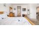 Bright bedroom featuring white walls, wood furnishings, ensuite bathroom, and comfortable carpet flooring at 4119 Mossy Limb Ct, Palmetto, FL 34221