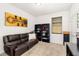 Cozy bedroom with a comfortable sofa and ample storage space with black bookshelves at 4119 Mossy Limb Ct, Palmetto, FL 34221
