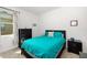 Comfortable bedroom with stylish dark furniture, light carpet, and large window at 4119 Mossy Limb Ct, Palmetto, FL 34221