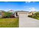 Charming single-story home with a well-maintained lawn, landscaping, and a two-car garage at 4119 Mossy Limb Ct, Palmetto, FL 34221
