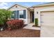 Charming home featuring manicured landscaping and a welcoming front entrance at 4119 Mossy Limb Ct, Palmetto, FL 34221