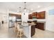 Gourmet kitchen features granite countertops, stainless steel appliances, and large island with seating at 4119 Mossy Limb Ct, Palmetto, FL 34221