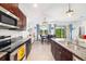 Kitchen with stainless appliances, granite countertops, and barstool seating island at 4119 Mossy Limb Ct, Palmetto, FL 34221