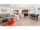 Spacious living room with an open layout to the modern kitchen and dining area at 4119 Mossy Limb Ct, Palmetto, FL 34221