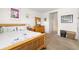 Inviting primary bedroom with warm wood furniture and bright, neutral decor at 4119 Mossy Limb Ct, Palmetto, FL 34221