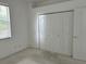 This bedroom features neutral carpeting, a large closet, and plenty of natural light at 4217 N Chamberlain E Blvd, North Port, FL 34286