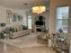 Bright and inviting living room with comfortable seating, stylish decor, and modern lighting at 4217 N Chamberlain E Blvd, North Port, FL 34286