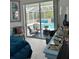 Bedroom with large sliding glass doors providing view to the screened pool and patio area at 4217 N Chamberlain E Blvd, North Port, FL 34286