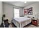Cozy bedroom with carpet, a ceiling fan, window and vibrant wall art at 4542 19Th S Ave, St Petersburg, FL 33711