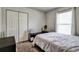 Simple bedroom features a closet, natural light from the window, and a black vanity at 4542 19Th S Ave, St Petersburg, FL 33711