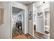 Bright hallway with modern flooring, leading to bedrooms and a bathroom with natural light at 4542 19Th S Ave, St Petersburg, FL 33711