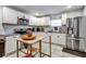Well-lit kitchen features stainless steel appliances, granite countertops, and an island at 4542 19Th S Ave, St Petersburg, FL 33711