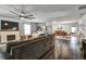 Spacious living room featuring a fireplace, modern ceiling fan, and seamless transition to the dining area at 4542 19Th S Ave, St Petersburg, FL 33711