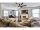 Comfortable living room with a cozy fireplace, large sectional sofa, and abundant natural light at 4542 19Th S Ave, St Petersburg, FL 33711