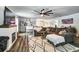 Stylish living room featuring modern decor, a fireplace, and an open layout to the dining area at 4542 19Th S Ave, St Petersburg, FL 33711
