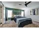 Primary bedroom features carpet, a ceiling fan and green accent wall at 4542 19Th S Ave, St Petersburg, FL 33711