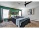 Bedroom features carpet, a ceiling fan and green accent wall at 4542 19Th S Ave, St Petersburg, FL 33711