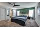Primary bedroom features carpet, barn-style ensuite door and green accent wall at 4542 19Th S Ave, St Petersburg, FL 33711