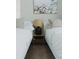 Bright bedroom with two twin beds, a wooden nightstand, and serene decor at 4549 Mcintosh Ln, Sarasota, FL 34232