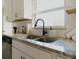 Modern kitchen with stainless sink, granite countertops, and plenty of natural light at 4549 Mcintosh Ln, Sarasota, FL 34232