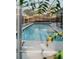 Stunning screened-in in-ground pool with a privacy fence and lounge chairs at 4549 Mcintosh Ln, Sarasota, FL 34232