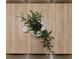 Stylized tabletop decor featuring greenery and a candle at 4549 Mcintosh Ln, Sarasota, FL 34232